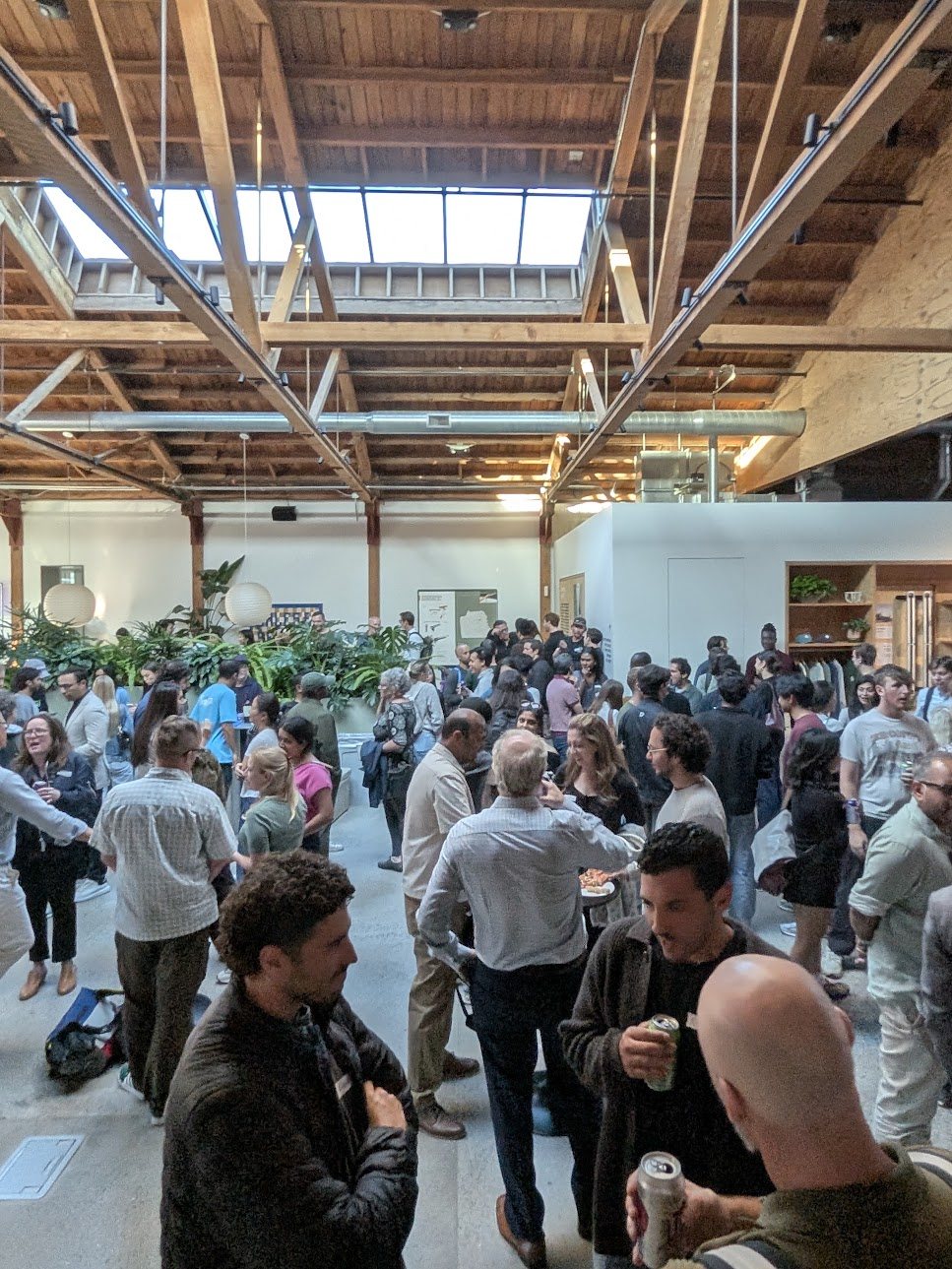 A lively MobilitySF crowd at the Rivian showroom